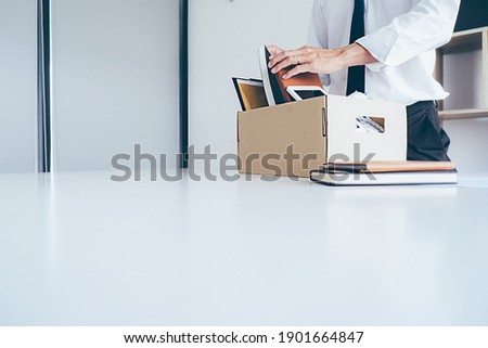 Sad dismissed businessman sitting outside the office after losing his job Royalty-Free Stock Photo #1901664847