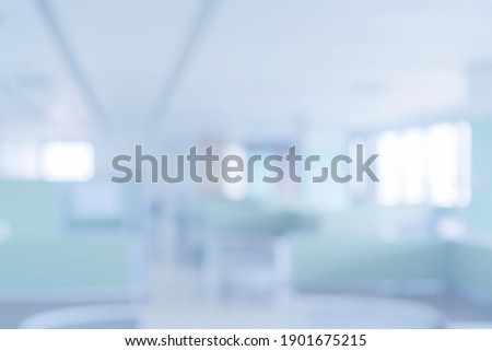 abstract blurred of hospital corridor blue color background concept.