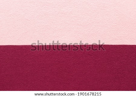 pink and burgundy knitted texture. abstract background. horizontal stripes