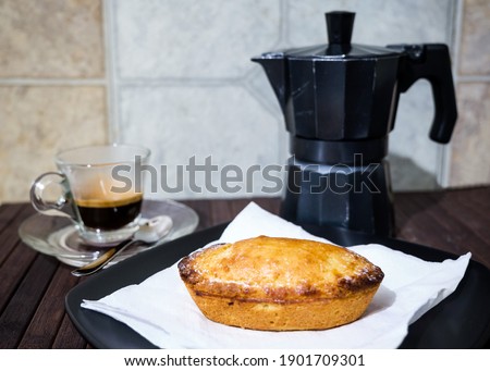 Classic Salento breakfast, in southern Italy one of the sweet bakery specialties is the "pasticciotto leccese" great to start a new day with a good coffee made with the classic moka. Royalty-Free Stock Photo #1901709301