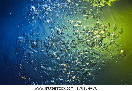 blue water with gold bubbles 