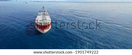 Aerial drone ultra wide panoramic photo of huge crude oil tanker anchored in open ocean deep blue sea