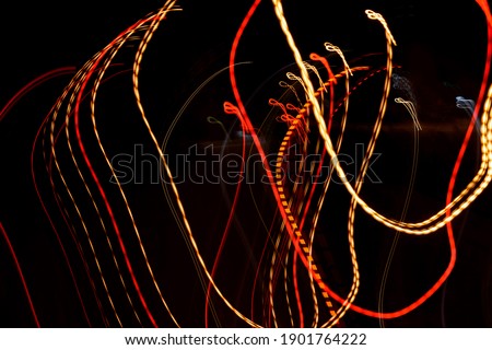 Blurry lines of urban street lighting resulting from camera movement at long exposure