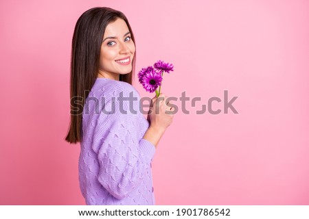 Profile side photo of young attractive girl happy positive smile hold flowers isolated over pink color background
