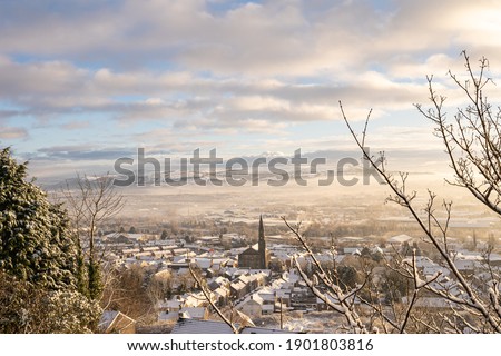 View of a snowy Morriston town centre from Trewyddfa road in Winter. Snow in Swansea, South Wales, the United Kingdom