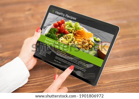 Woman browsing meal recipes on tablet