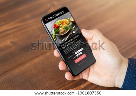 Man ordering food online on mobile phone