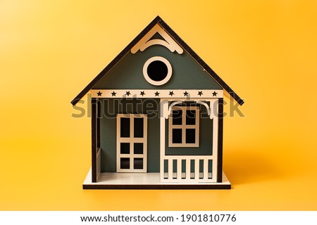 Minimal cute house isolated on yellowl background