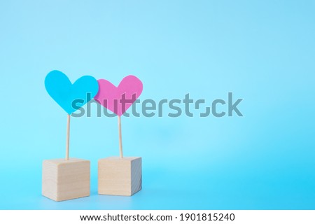 Pink and blue heart shape icon cutout together with copy space. Valentine's Day celebration, marriage, couple and love concept.