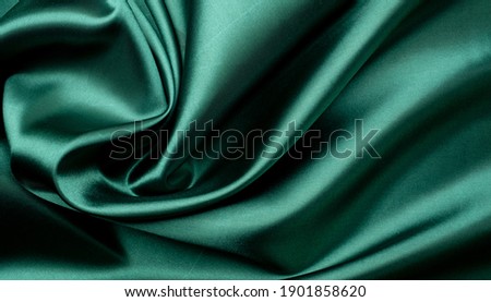 green fabric texture background, abstract, closeup texture of cloth
