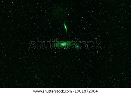 Galaxy in green tones, in deep space. Elements of this image were furnished by NASA. High quality photo