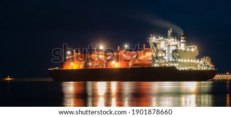 Tanker in the port with lights on, night photography