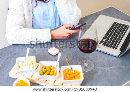 woman using smartphon  aperitif. female having fun with smartphones making aperitif - Closeup of hands social networking with mobile cellphones - Technology and phone addiction concept - Main focus in