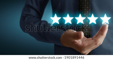 Rise on increasing five stars in human hand, Increase rating evaluation classification concept