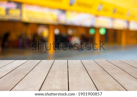 Empty old wooden front of outdoor of store background with sunlight and bokeh with empty copy space. Ready for product display montage concept.