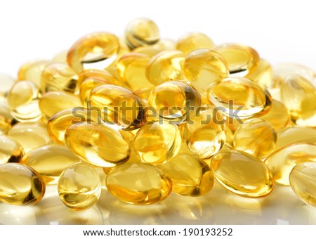 Fish oil pill on white background