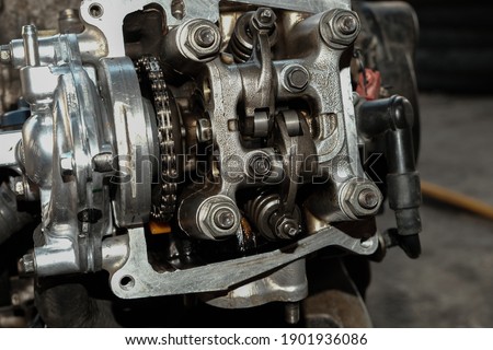 Repairing intake and exhaust valves and motorcycle engine cylinder heads