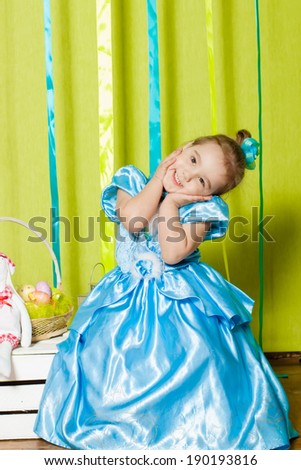  Little girl in a beautiful  blue dress 