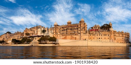 Panorama of the Udaipur City Palace Complex from lake Pichola in Rajasthan, India Royalty-Free Stock Photo #1901938420