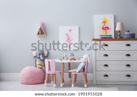 Children's room with modern furniture and pictures. Interior design