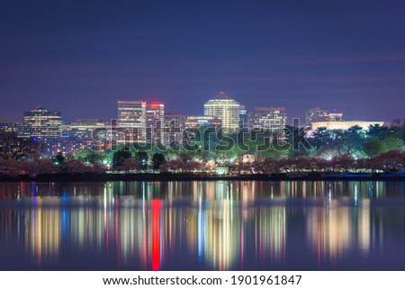 View of Rosslyn, Arlington, Virginia, USA from the tidal basin in Washington DC at dusk during spring season.