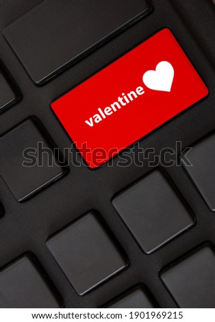 key button with heart sign on a computer keyboard, valentine's day concept, closeup