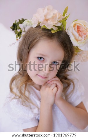 portrait of a beautiful blonde girl with flowers