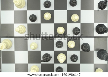 Black and white photo with a picture of a chess Board and chess pieces, Wooden chess pieces on a chess Board