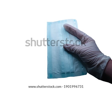 Mask in hand on white background