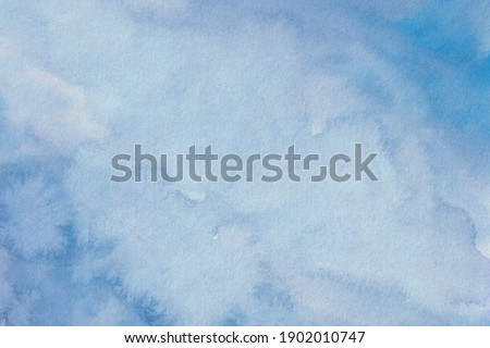 Soft blue hand painted watercolor abstract background