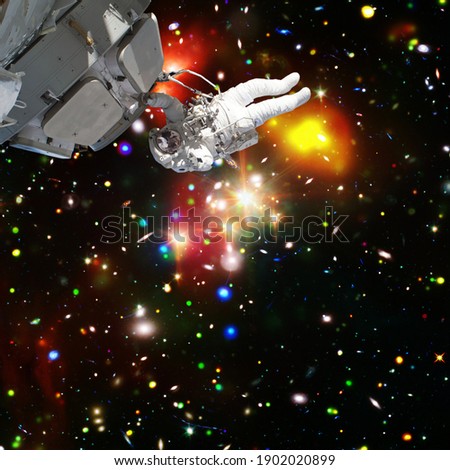 Astronaut and starfield. The elements of this image furnished by NASA.

