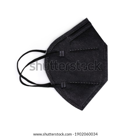 FFP2 disposable black mask. Medical equipment isolated on white background. Royalty-Free Stock Photo #1902060034