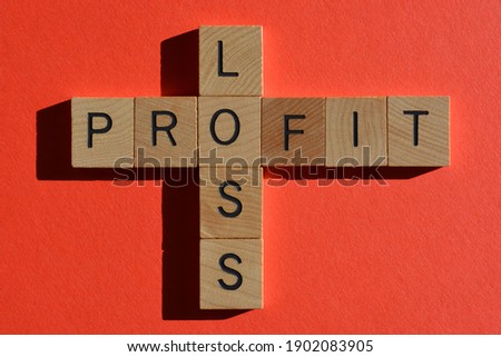 Profit, Loss, words in wooden alphabet letters in crossword form isolated on bright red background 