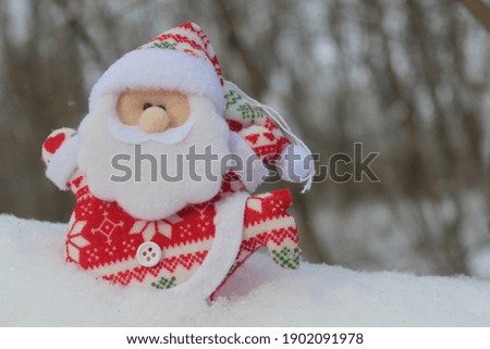 Santa Claus run on the snow in the forest in xmas time. Christas card with Santa.