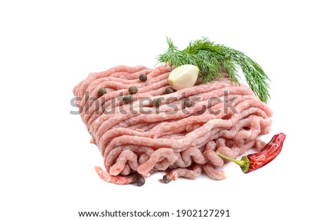 Fresh pork and beef minced meat, garnished with garlic, red pepper and dill.Isolated on a white background.