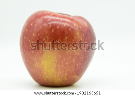 Large Beautiful Cosmic Crisp Apple  Against Bright White Background  Royalty-Free Stock Photo #1902163651