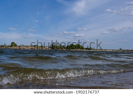 Baltic coast with beautiful blue skies and small waves in the sea