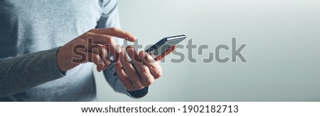 man hand holding smart phone