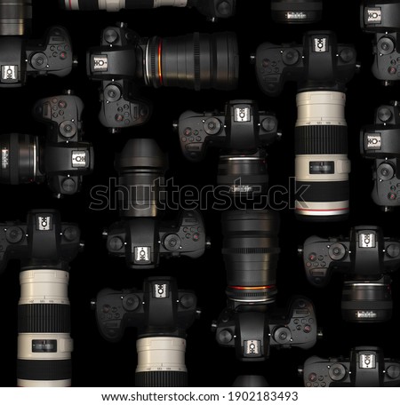 Mirrorless Cameras with different lenses for shooting videos. Top view of digital cameras isolated on black background. Photography pattern design.