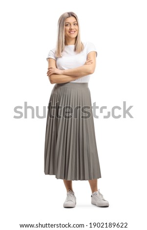 Full length portrait of a young blond woman in a pleated skirt isolated on white background Royalty-Free Stock Photo #1902189622