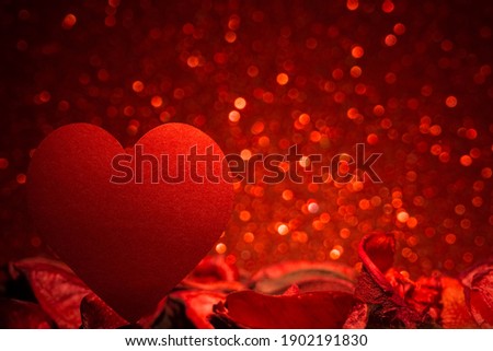 Silhouette heart shapes isolated on red bokeh background. 