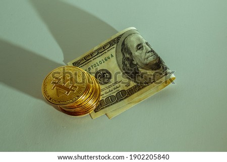 Bitcoin holds the US dollar. The concept of stock market advantage. High quality photo