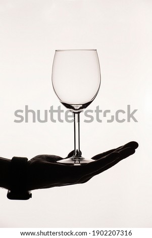 A vinous glass in sure hands