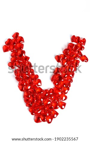 The inscription love is made of red glass hearts. Isolate on a white background. Letter V