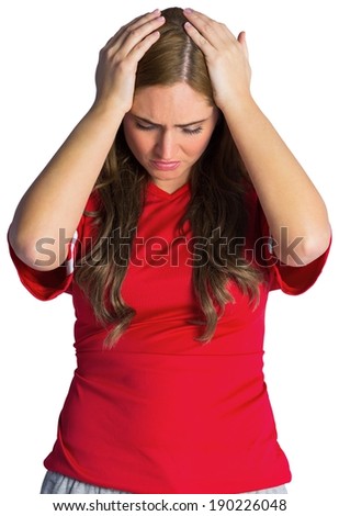 Disappointed football fan looking down on white background