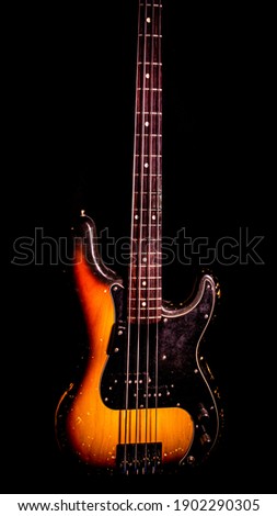 Front Of Precision Style Electric Vintage Bass Guitar Sunburst With Black Background