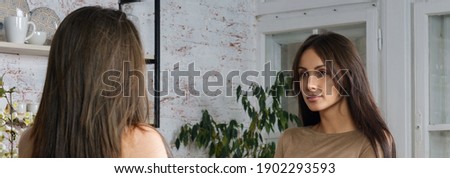 Two young women having conversation at home