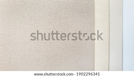 close up blind or curtain linen fabric texture samples in color chart. warm tone color of textile fabric with sunproof function for home or office . interior material selection.