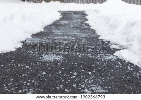Winter road with salt for melting snow