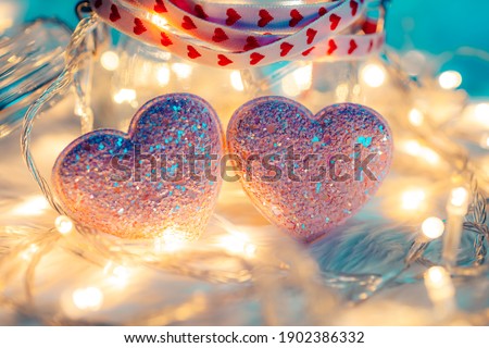 heart shape, Foam beads, feather and light decorative bokeh on blue cloth. Love, Valentine and holiday concept.